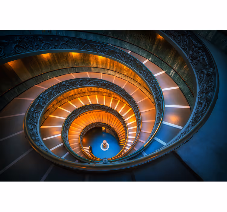 Fototapeta krajobraz oświetlona spiralnymi schodami - TenStickers