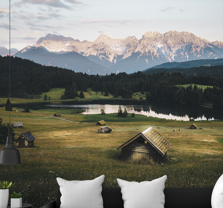 Fototapeta góry i słoneczne pole z domkami - TenStickers