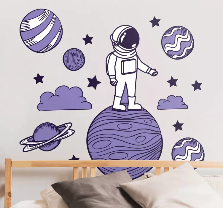 Naklejka kosmos na ścianę Astronauta rysuje z planetami - TenStickers