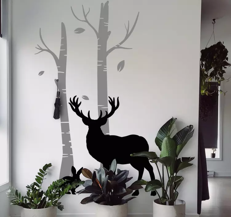 Naklejka wieszak jelenie w pobliżu drzew - TenStickers