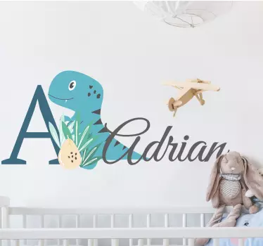 Naklejka do pokoju niemowlaka niebieski dinozaur z imieniem - TenStickers